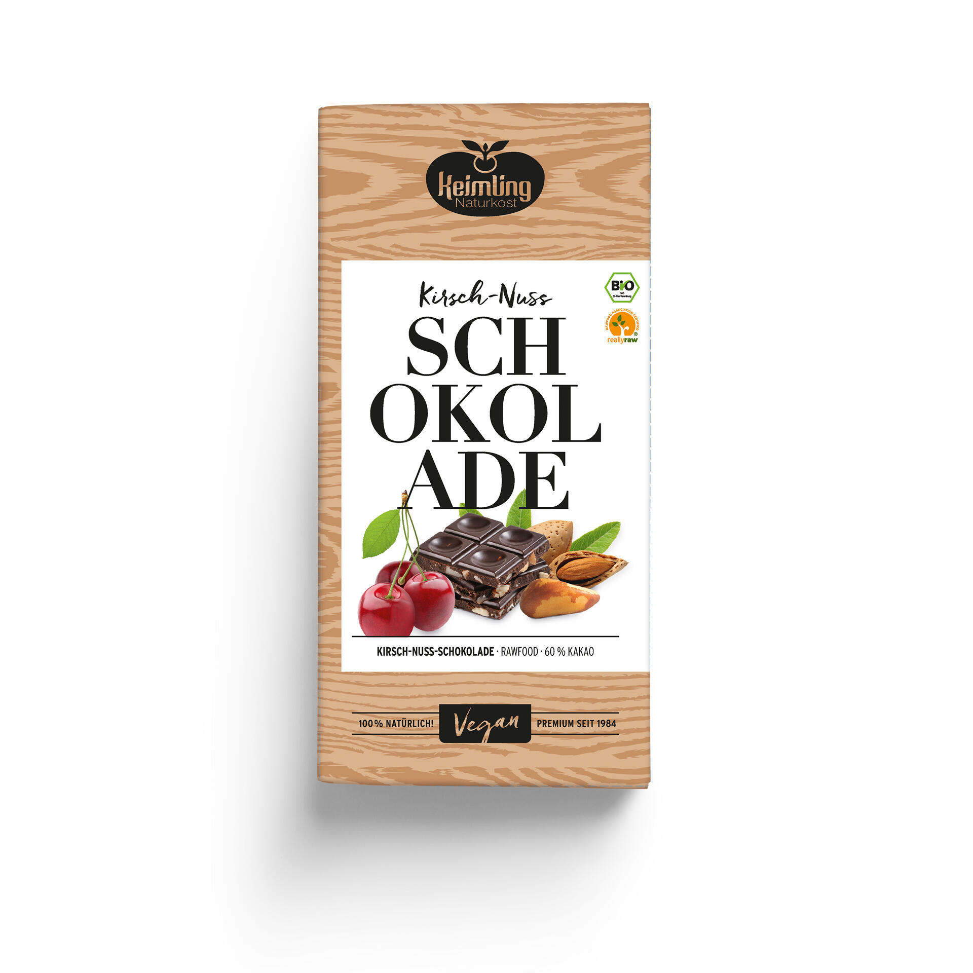 Kirsch-Nuss-Schokolade Keimling Kirsch-Nuss-Schokolade mit 60 % Kakao zeigt Kirschen, Nüsse und Schokoladenstücke. Verpackung betont Bio, Vegan, 100 % natürlich und Premium seit 1984.