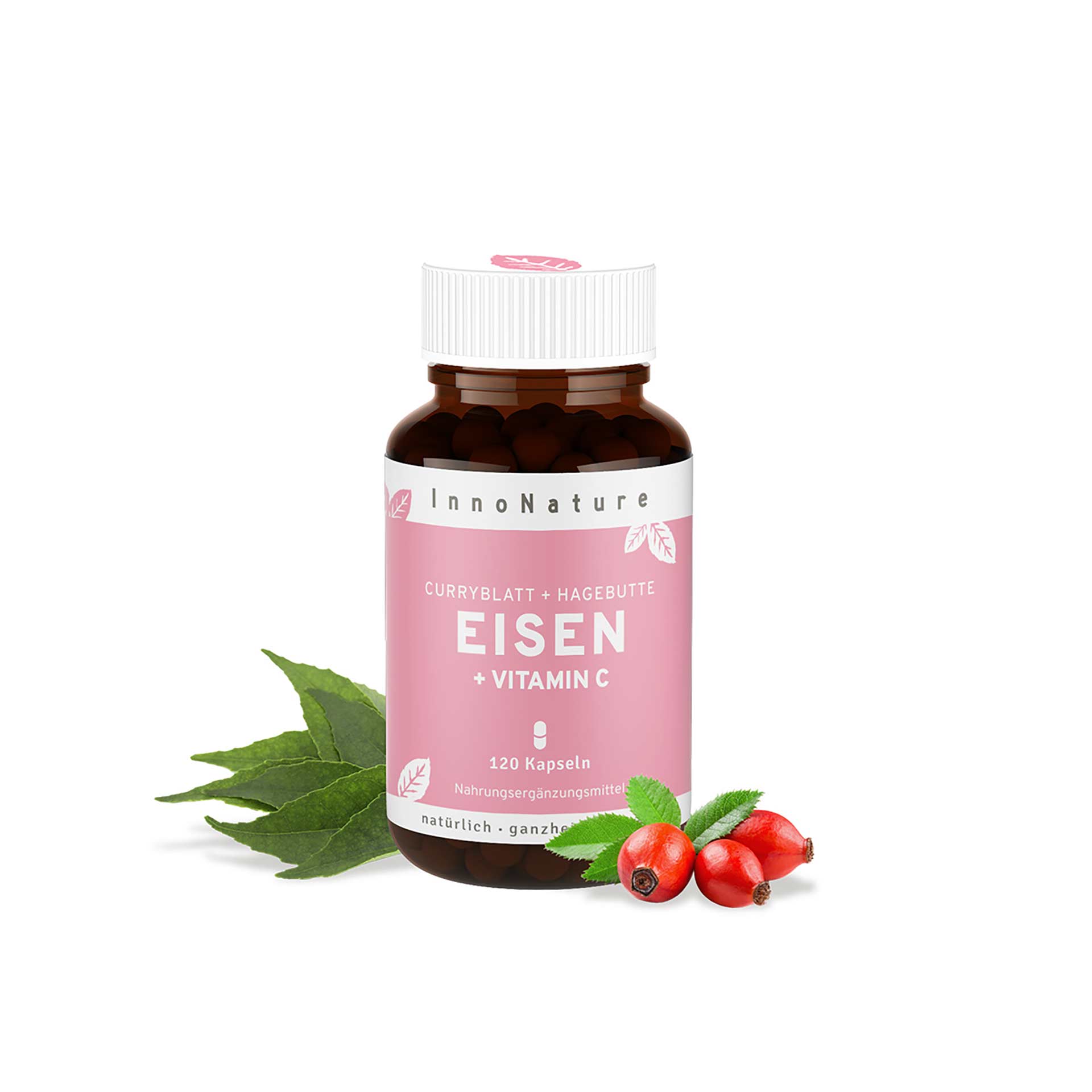 Innonature Eisen + Vit. C Kapseln, 120 Tabl.94.4 g Braune Flasche mit weißem Deckel, rosa Etikett mit Text InnoNature Curryblatt + Hagebutte EISEN + VITAMIN C 120 Kapseln. Daneben drei rote Hagebutten mit grünen Blättern und Curryblätter.