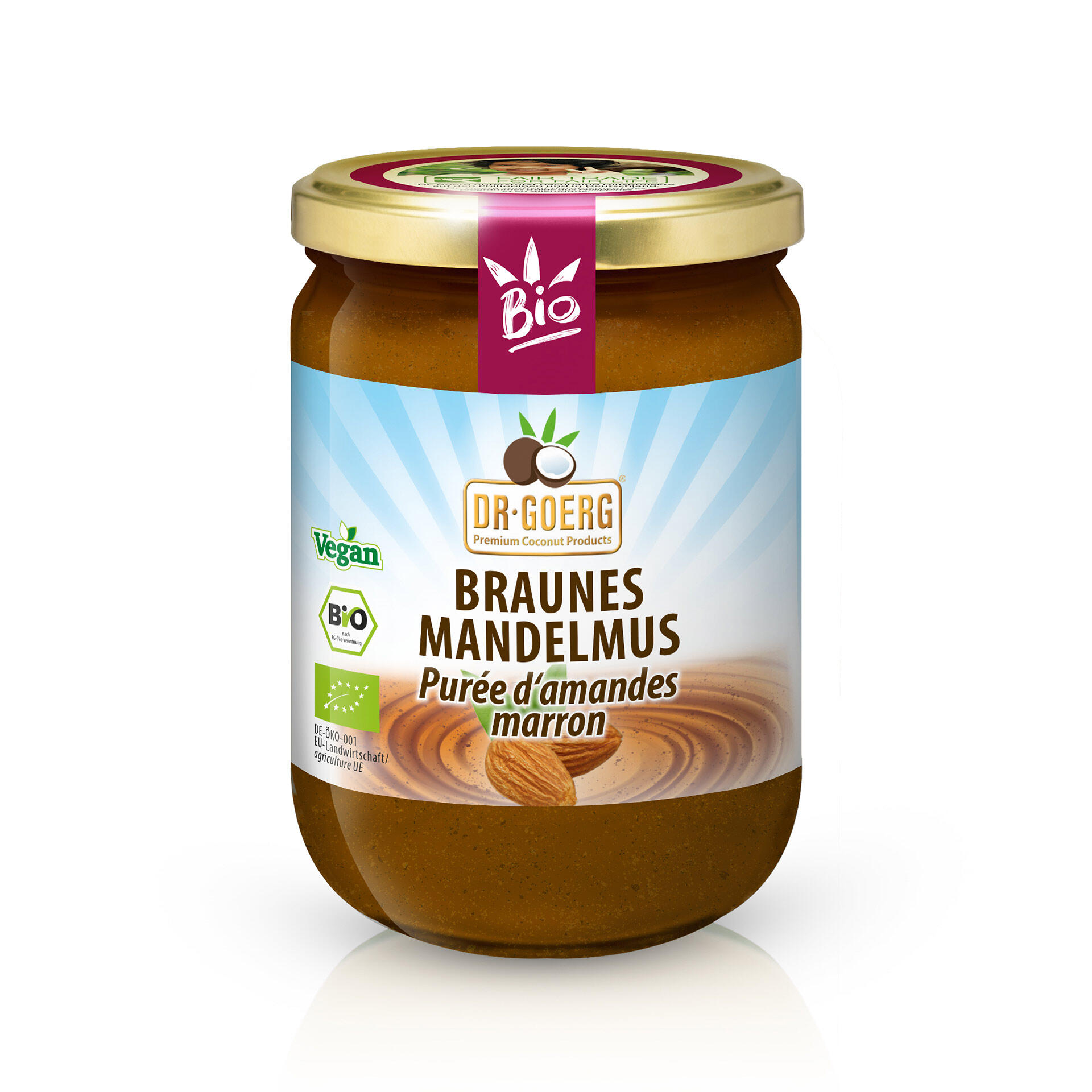 Glas mit braunem Mandelmus der Marke Dr. Goerg mit Golddeckel. Label zeigt Bio, Vegan und Braunes Mandelmus Purée d'amandes marron.