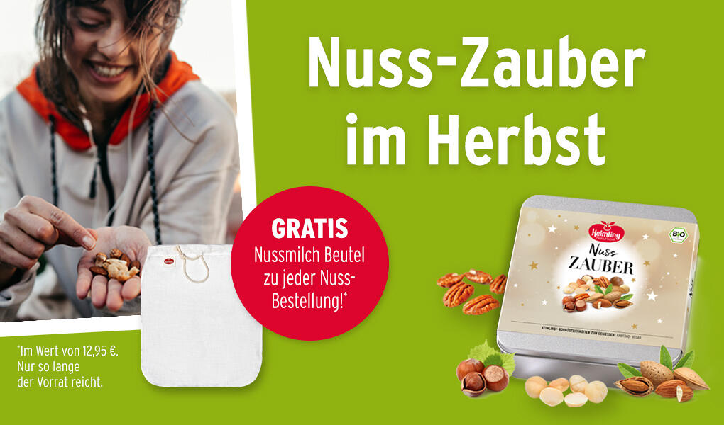 Frau hält mehrere Nüsse in der Hand und lächelt. Daneben steht ein Stoffbeutel mit dem Text: Gratis Nussmilch Beutel zu jeder Nuss-Bestellung! und eine Bio-Geschenkdose Nuss-Zauber mit verschiedenen Nüssen.