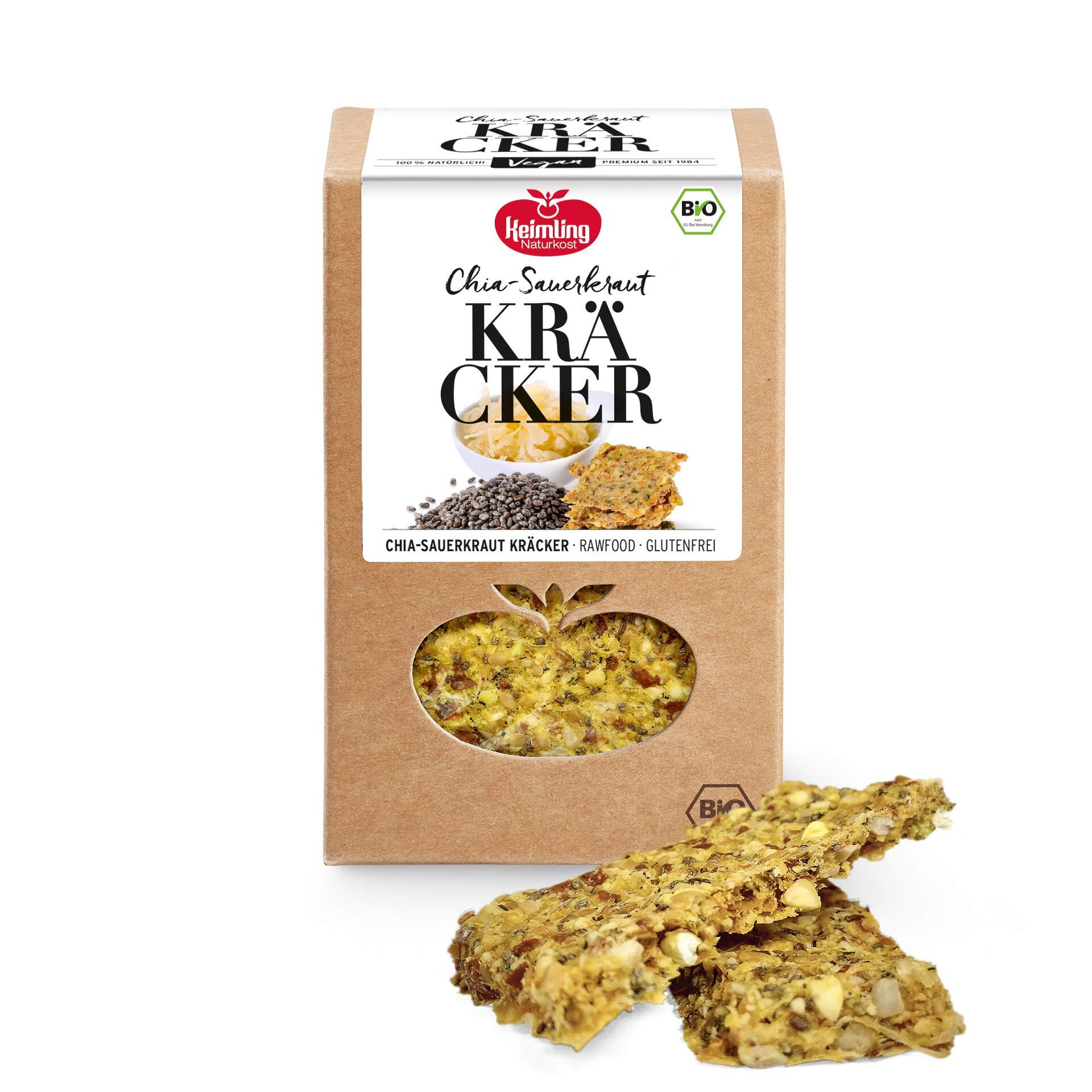 Chia-Sauerkraut Kräcker, bio 120 g Verpackung der Keimling Naturkost Chia-Sauerkraut Kräcker mit Sichtfenster und zwei Kräckern davor. Auf der Verpackung stehen die Begriffe Chia-Sauerkraut, Kräcker, Rawfood und Glutenfrei.
